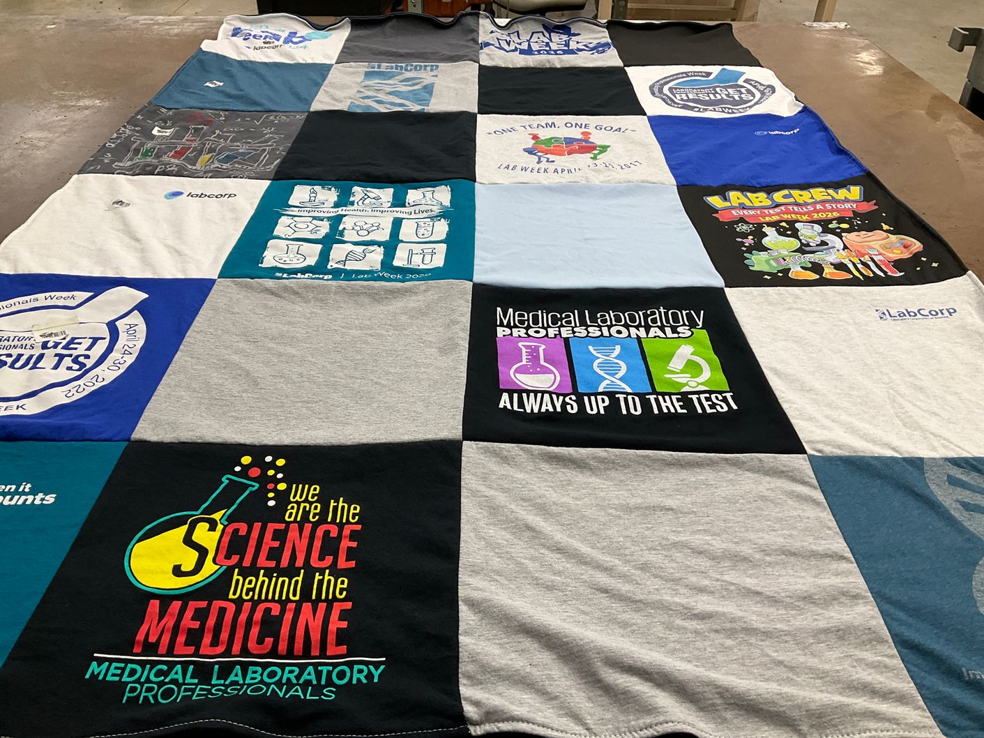 T-shirt quilt with laboratory, medicine themes by Caressa from VA