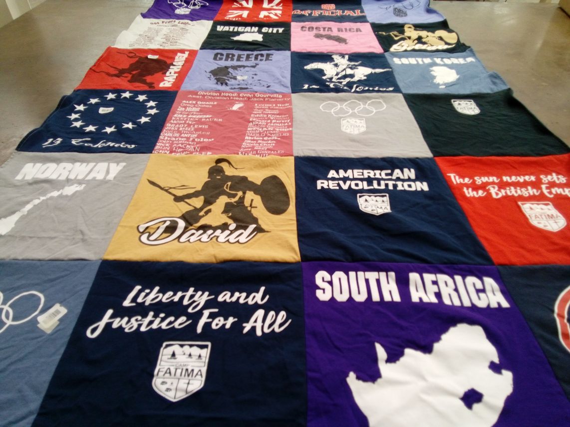 T-shirt quilt with history, international travel themes by Laurel from MA