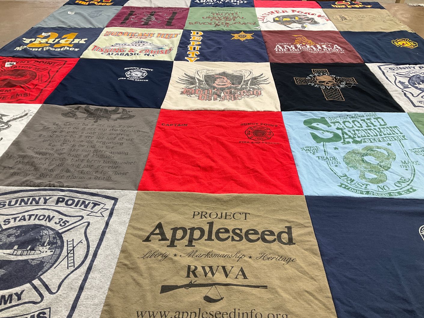 T-shirt quilt with marksmanship, heritage themes by Jeremy from NC
