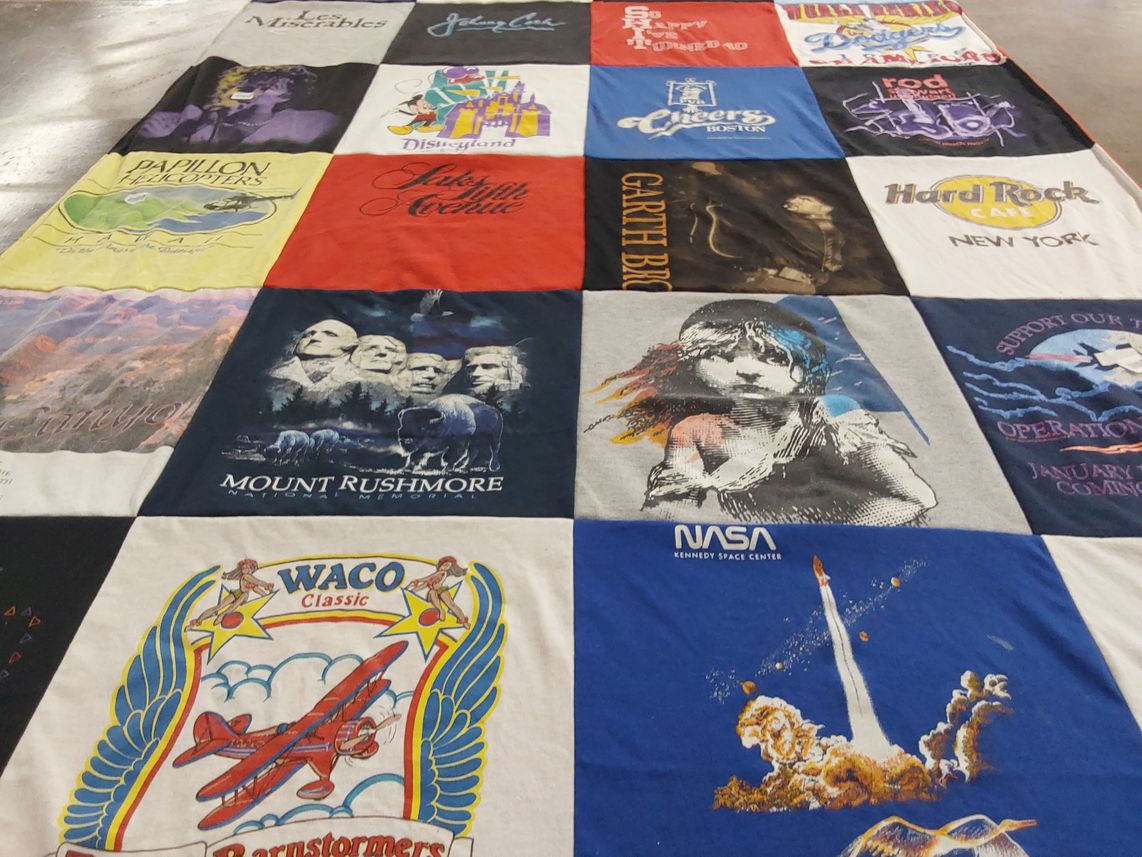 T-shirt quilt with theater, travel themes by Shirlene from ID