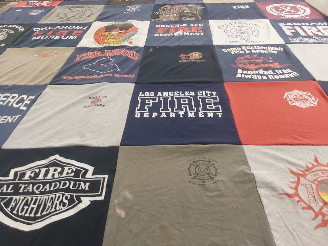T-shirt quilt with firefighting, emergency services themes by Pamela from TX