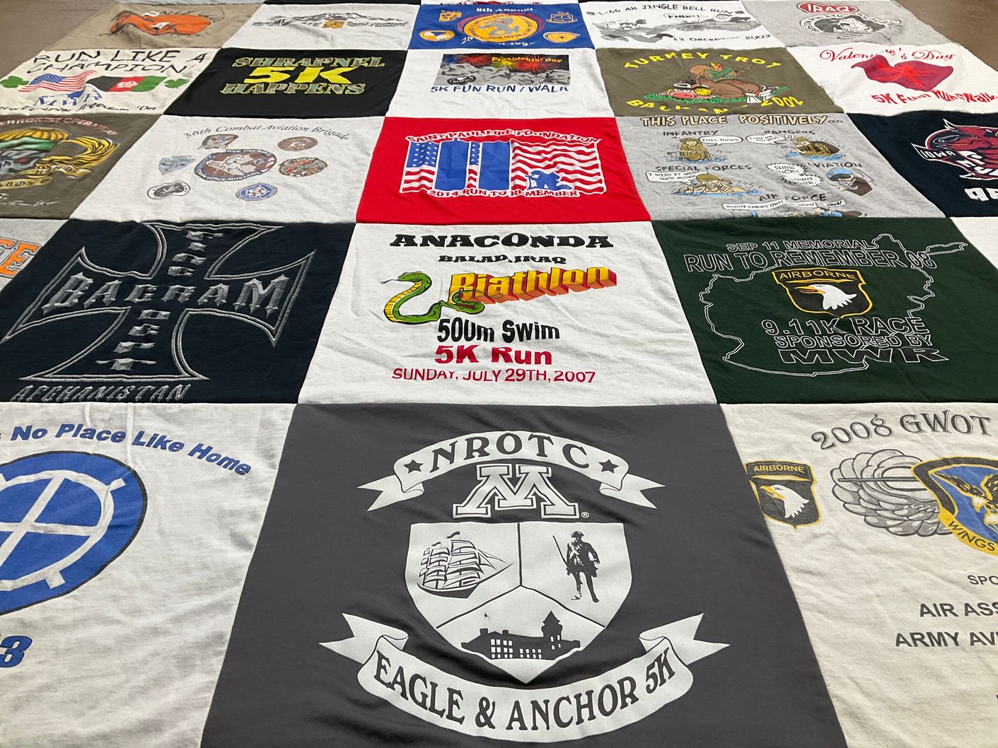T-shirt quilt with running, military themes by Carl from WI