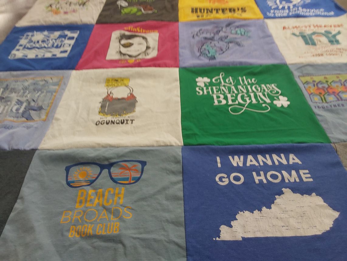 T-shirt quilt with reading, beach activities themes by Kathleen from CT