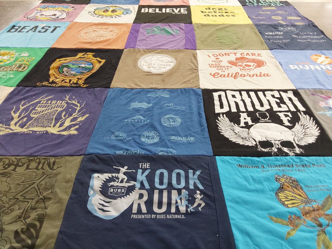 T-shirt quilt with running, outdoors themes by Mary from NC