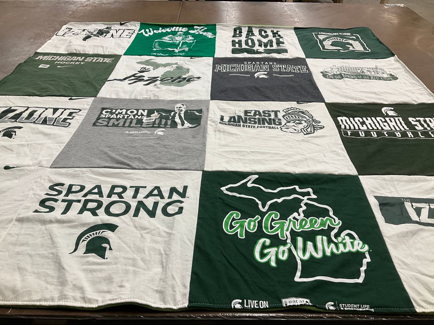 T-shirt quilt featuring michigan state university hockey, michigan state university football by Suzanna from MI