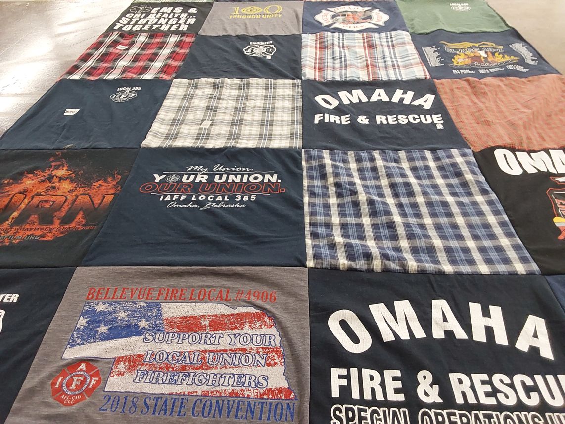T-shirt quilt with firefighting, community service themes by Renee from NE