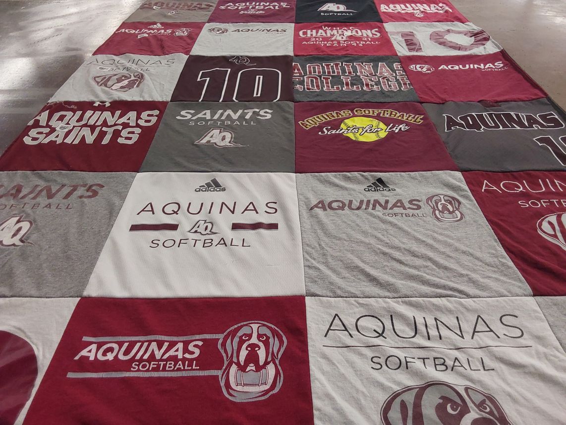 T-shirt quilt featuring aquinas saints by Leah from MI