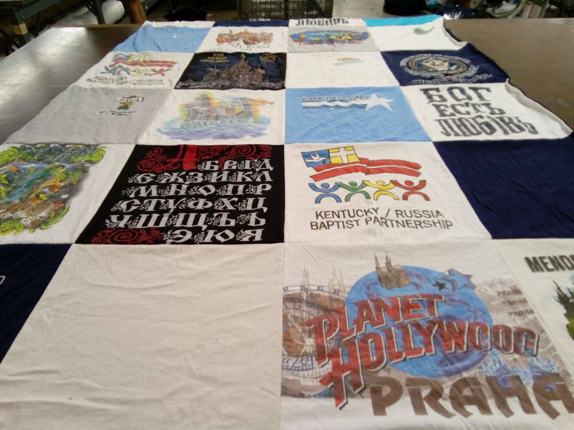 T-shirt quilt with international partnerships, travel themes by Nina from KY