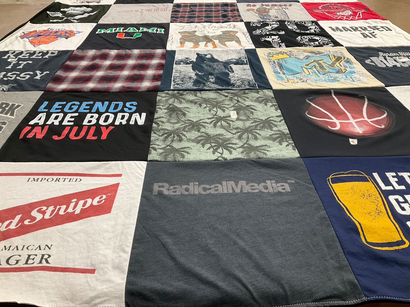 T-shirt quilt with sports, music themes by elise from NY
