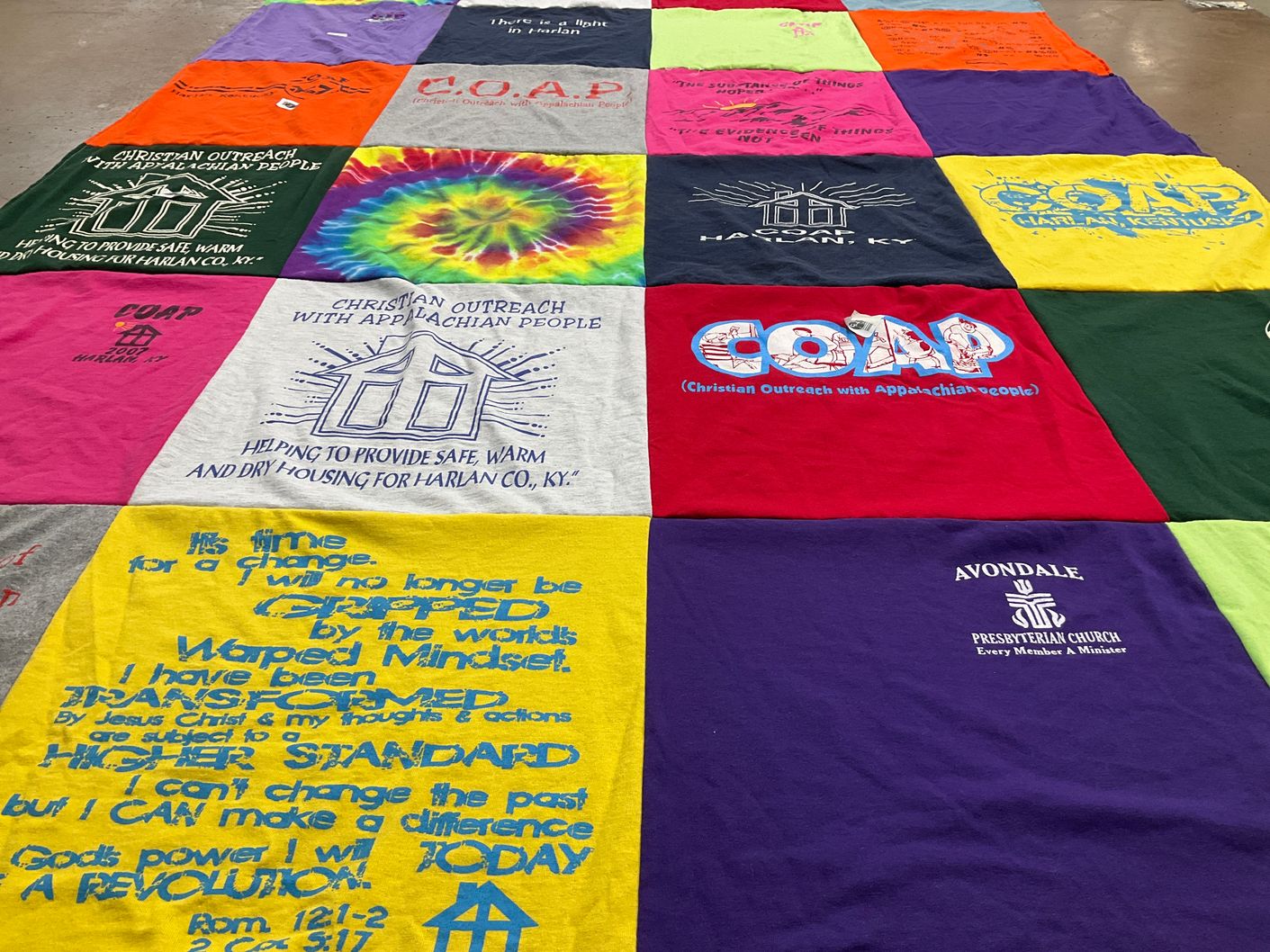 T-shirt quilt with community service, housing assistance themes by Elizabeth Page from NC