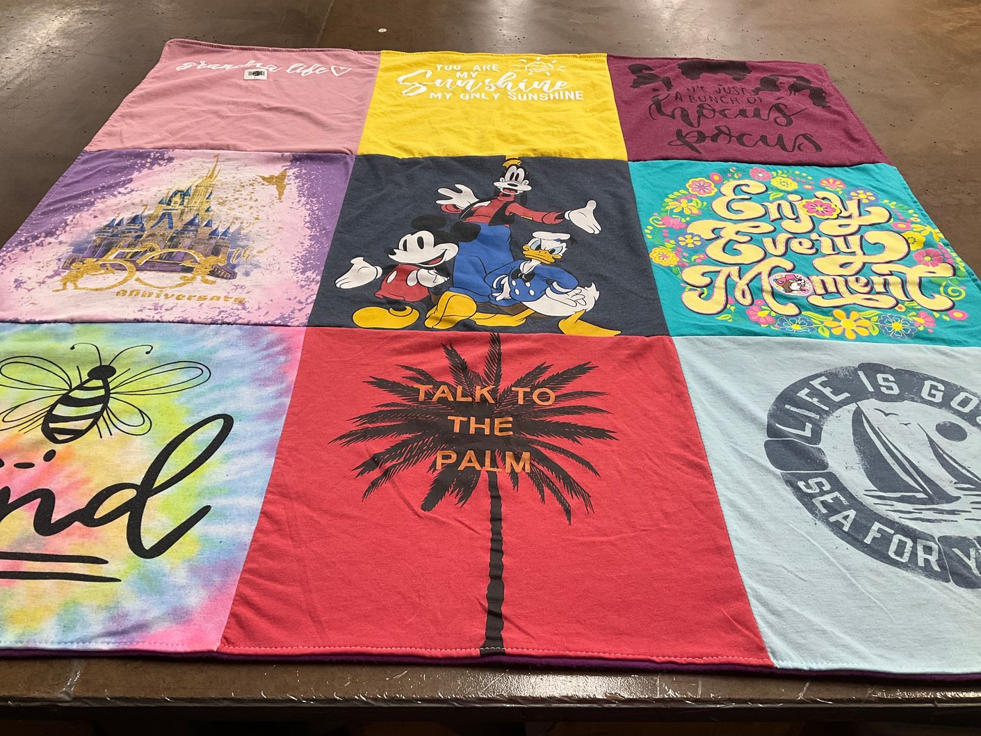T-shirt quilt with disney, travel themes by Margaret from MO