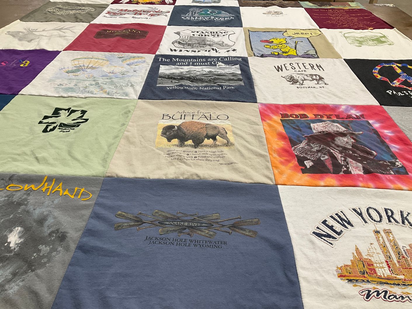 T-shirt quilt with travel, music themes by Jo from IL
