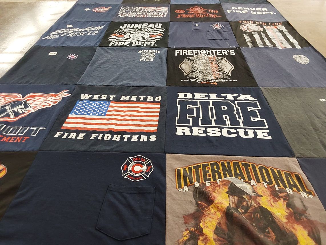 T-shirt quilt with firefighting, community service themes by Michelle from CO