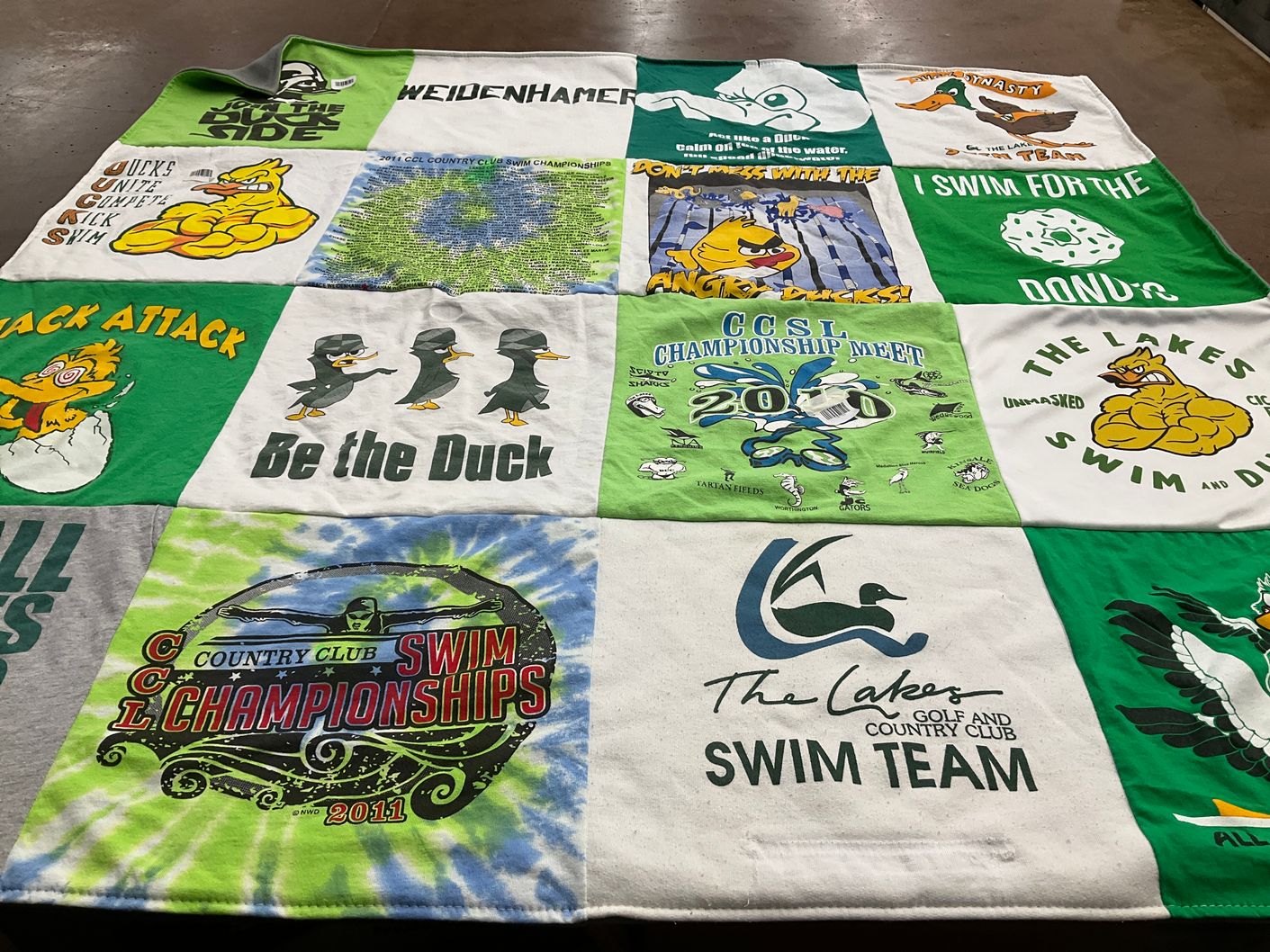 T-shirt quilt featuring the lakes swim team by Heather from OH