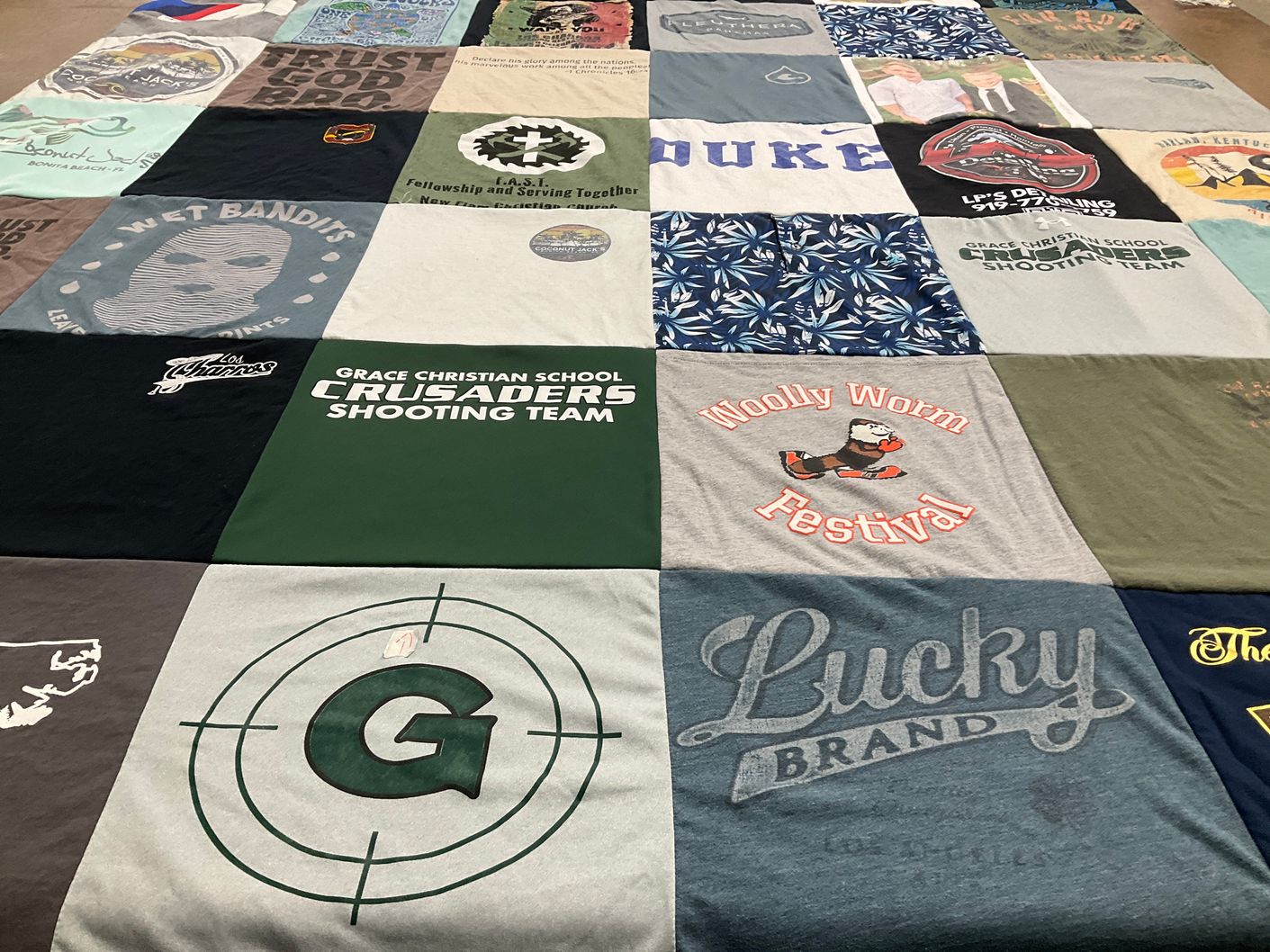 T-shirt quilt featuring grace christian school crusaders shooting team by Lindsay from NC