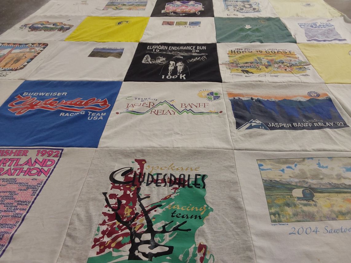 T-shirt quilt with running, endurance events themes by Kris from WY
