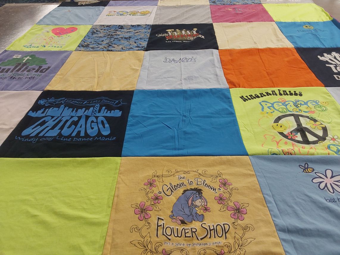 T-shirt quilt with dance, travel themes by Rita from NY