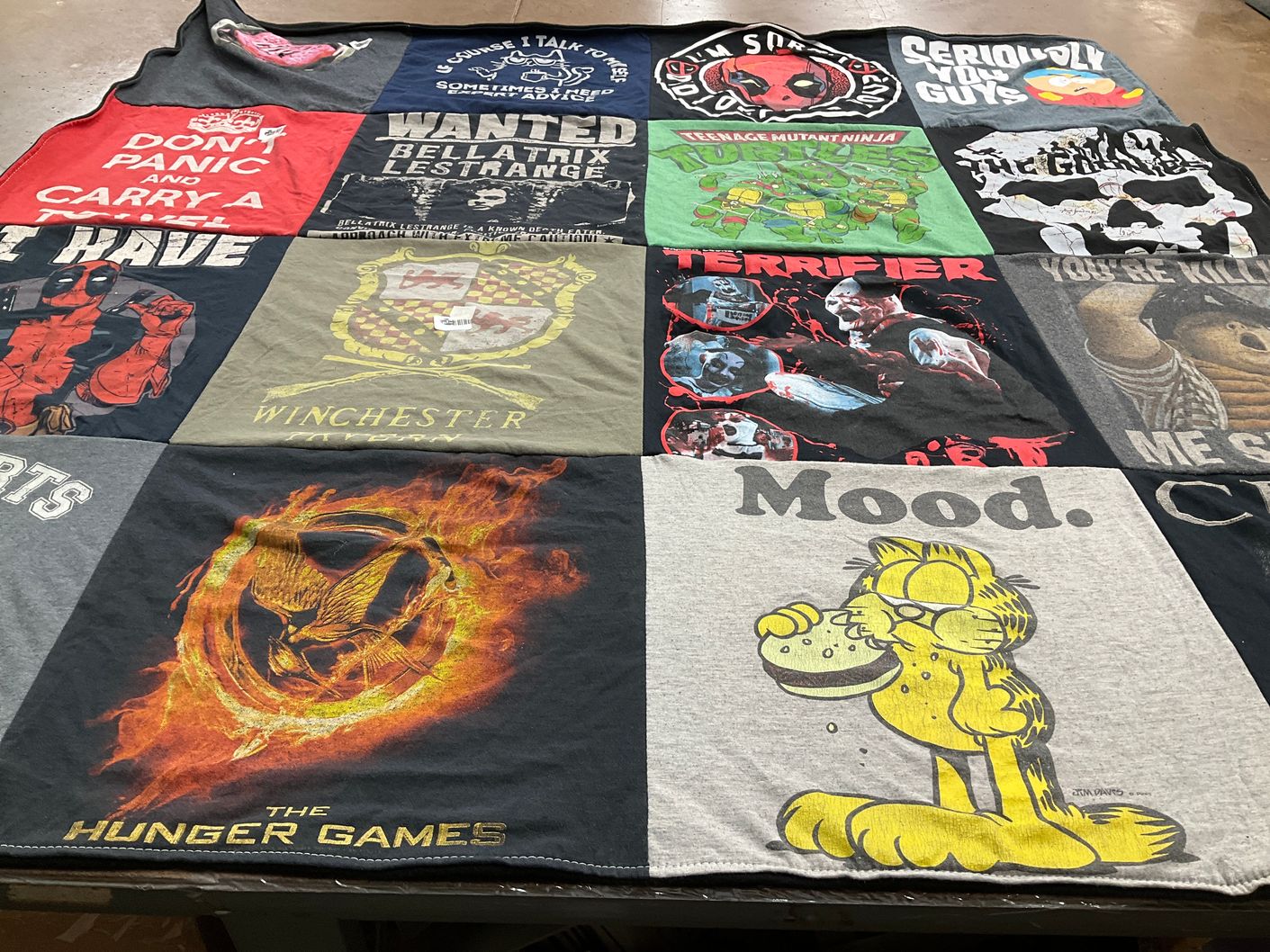 T-shirt quilt with pop culture, movies themes by Mary from FL