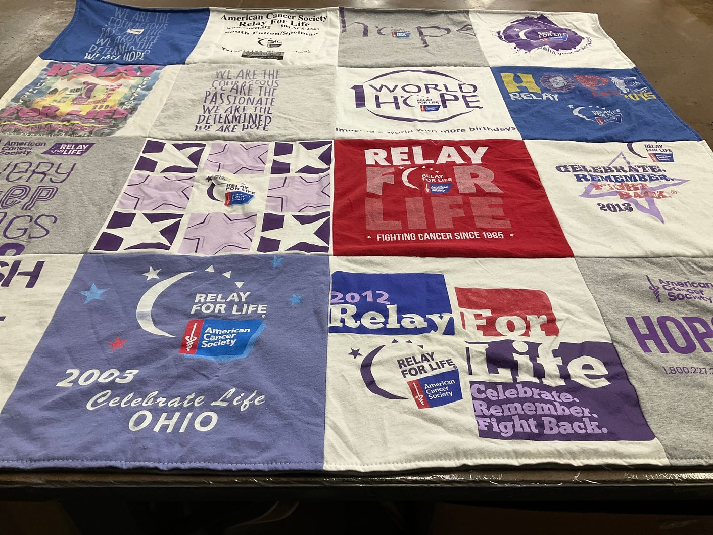 T-shirt quilt with cancer awareness, charity themes by Remy from GA