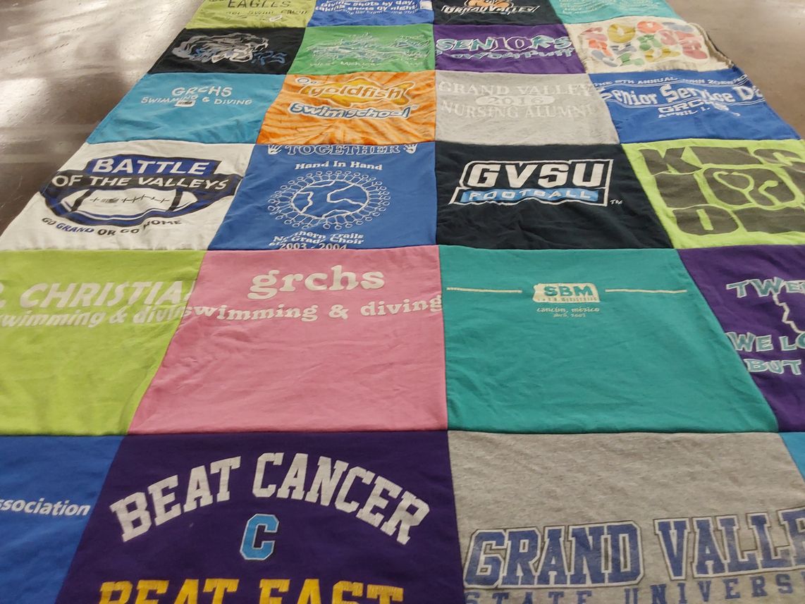 T-shirt quilt featuring gvsu football, grchs swimming & diving by Jess from MI