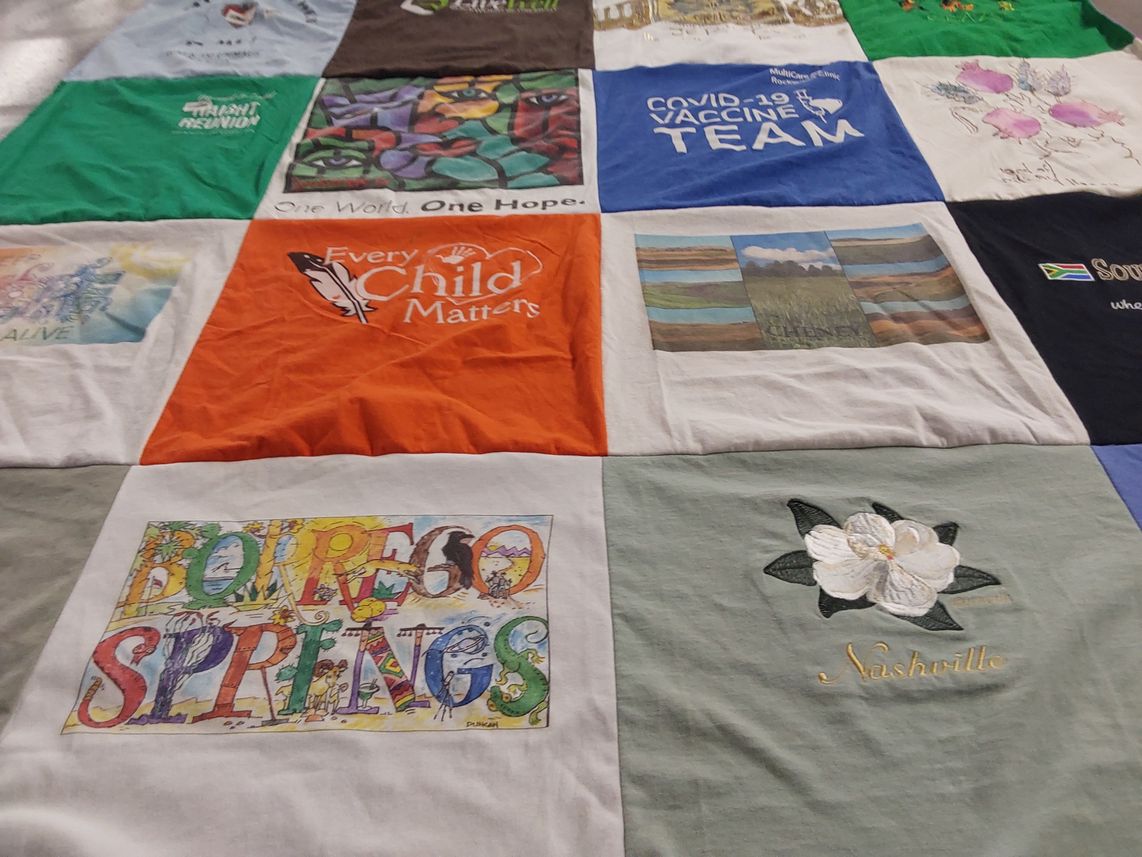 T-shirt quilt with public health, community service themes by Janet from WA