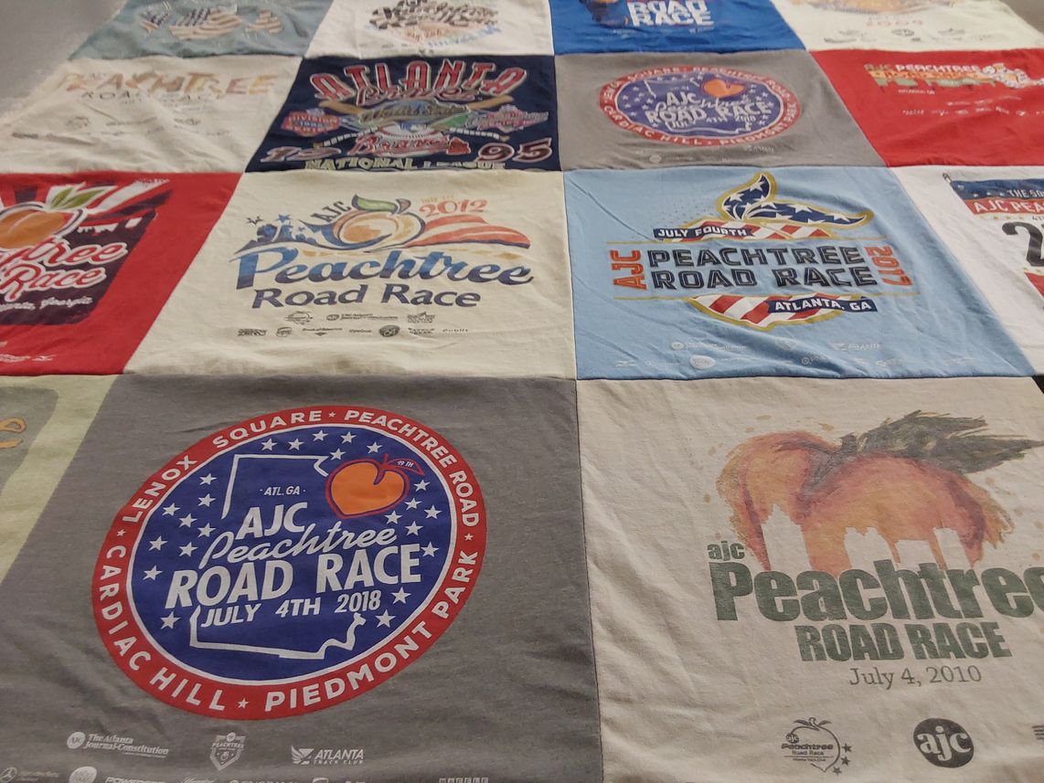 T-shirt quilt with running, sports themes by Erik from FL