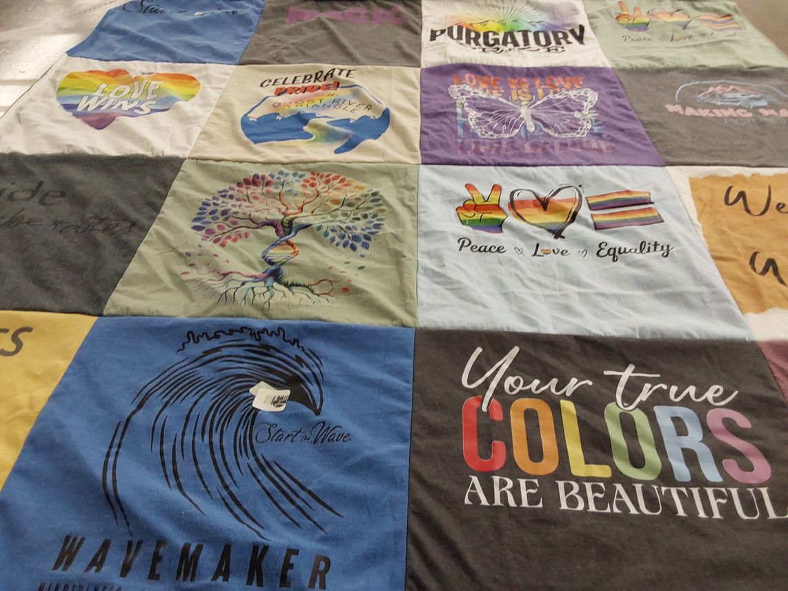 T-shirt quilt with pride, equality themes by Carolyn from MI
