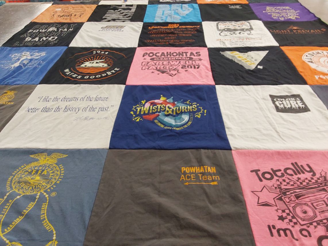 T-shirt quilt with education, community events themes by Amber from VA