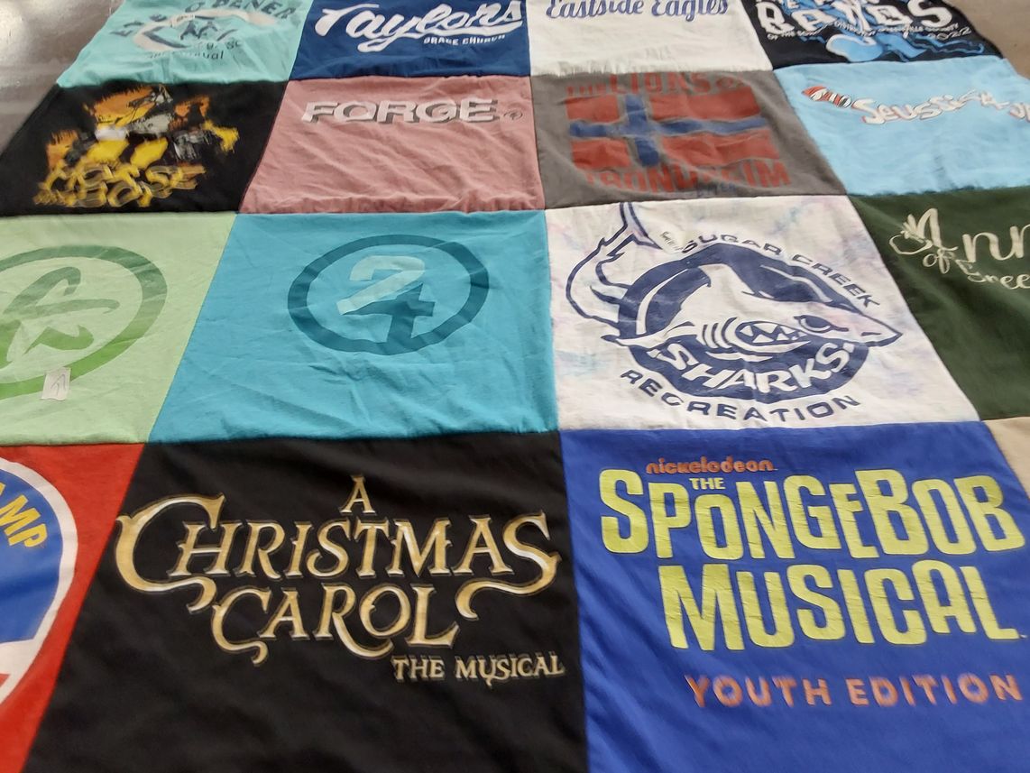 T-shirt quilt with theater, music themes by Mary Beth from SC
