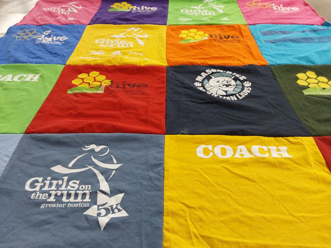 T-shirt quilt with running, community themes by Emily from MA