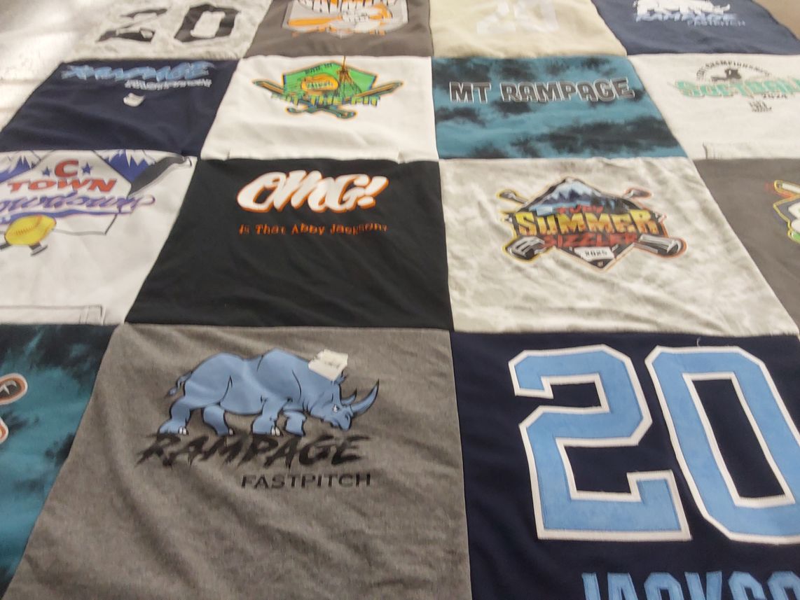 T-shirt quilt with softball, hockey themes by Lindsey from ID