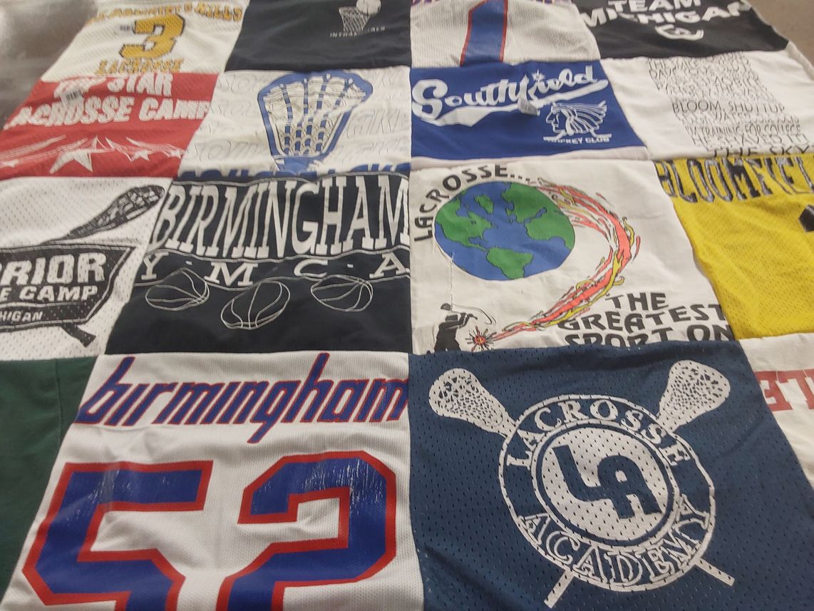 T-shirt quilt with lacrosse, sports themes by Kristina from SC