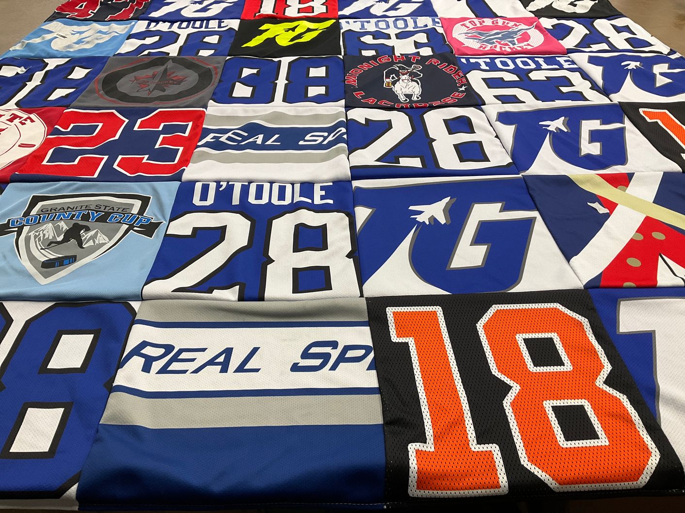 T-shirt quilt with sports themes by Amanda from NH