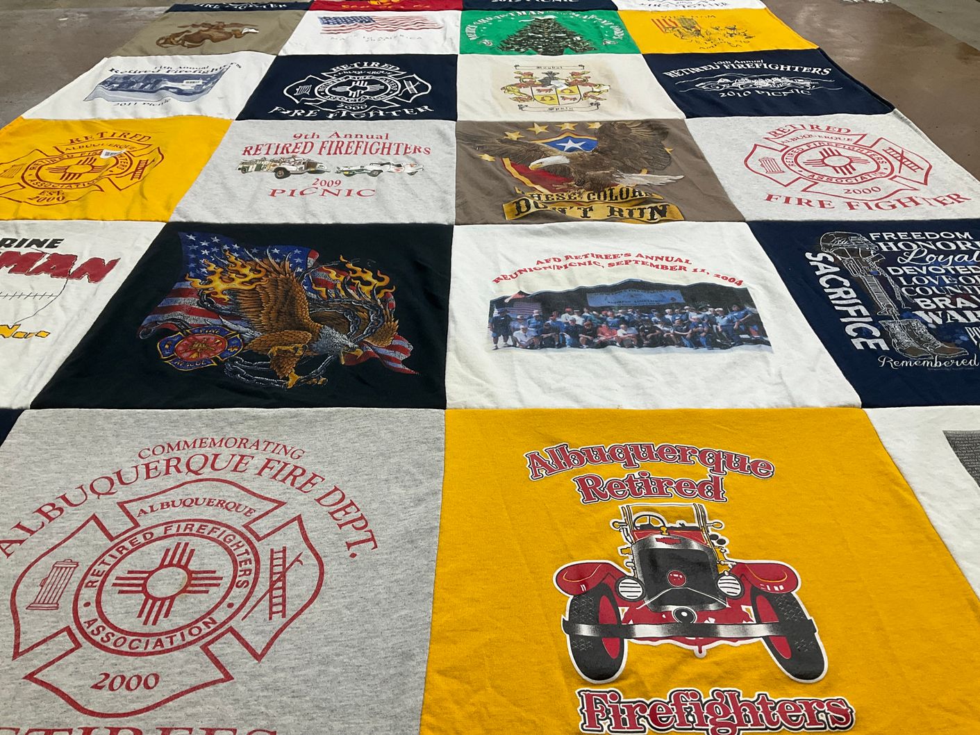T-shirt quilt with firefighting, community events themes by Celeste from NM