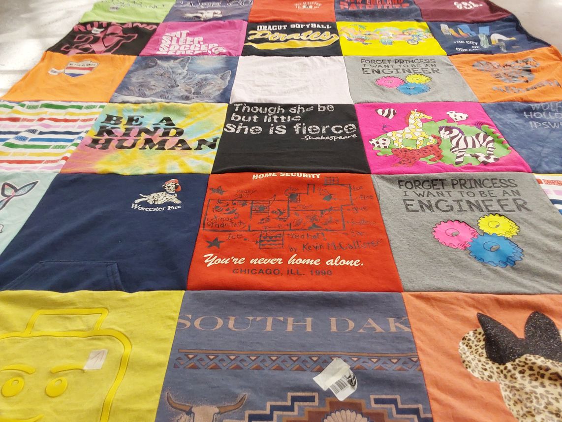 T-shirt quilt with fire safety, engineering themes by Allison from MA