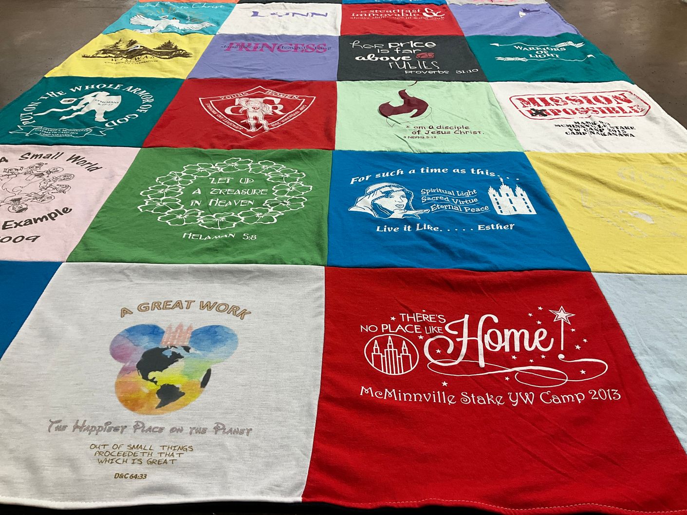 T-shirt quilt with arts and crafts, community service themes by Judy from TN