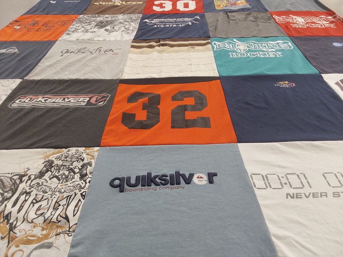 T-shirt quilt with sports, boarding themes by Susan from KY