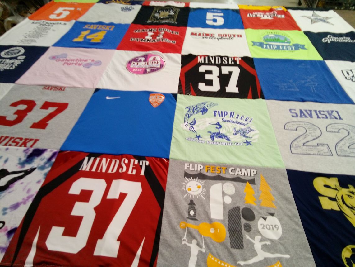 T-shirt quilt with gymnastics, camping themes by Jen from IL
