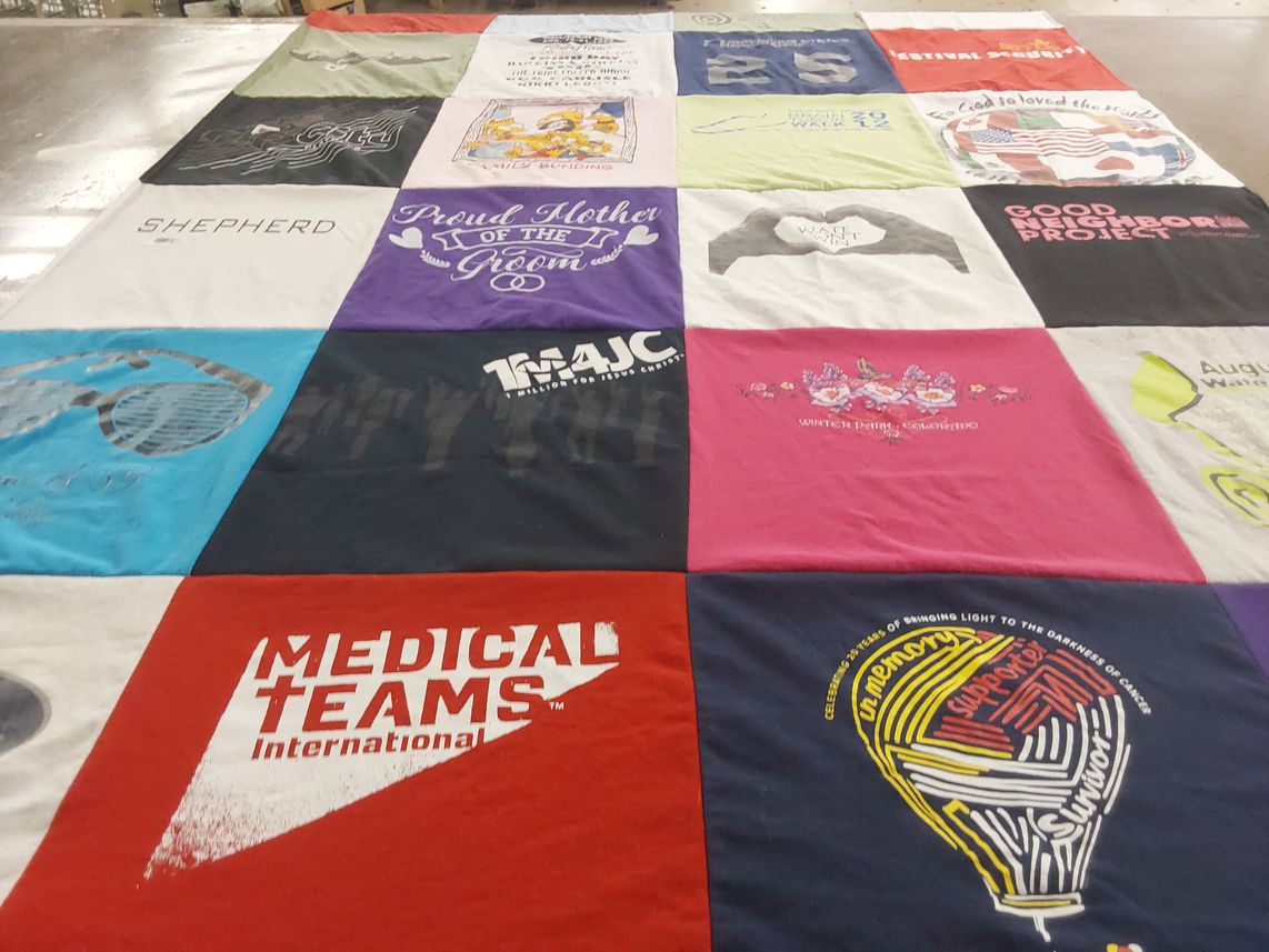 T-shirt quilt with community, support themes by Sally from OR