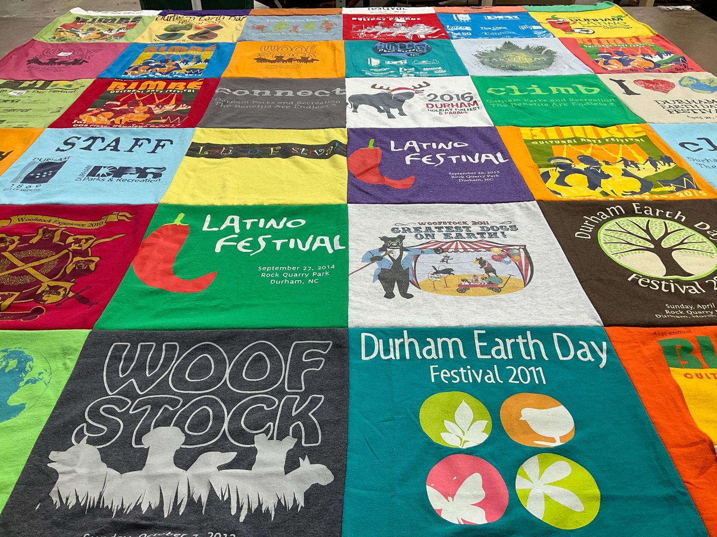 T-shirt quilt with community events, environmental awareness themes by Hunter from NC