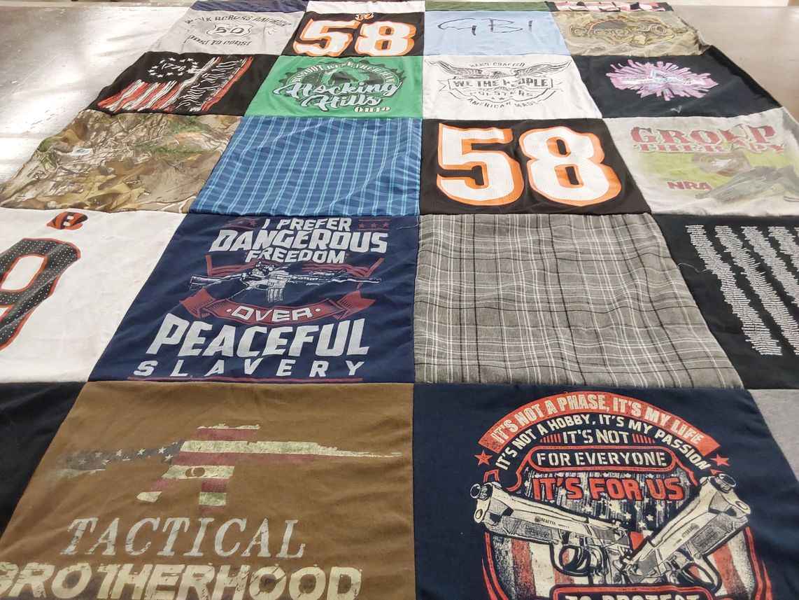 T-shirt quilt with firearms, outdoor activities themes by Cinda from OH