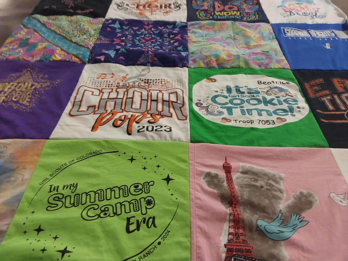 T-shirt quilt with scouting, music themes by Ayse from CO