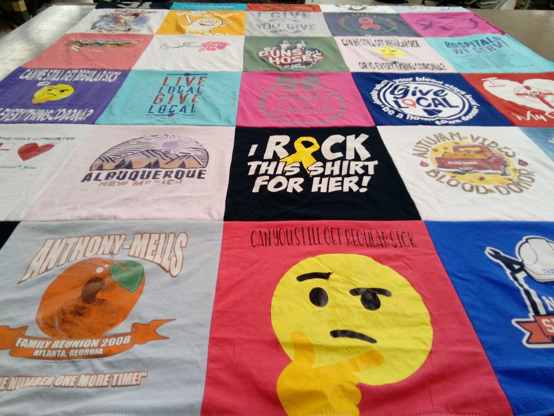 T-shirt quilt with local events, blood donation themes by Beverly from GA