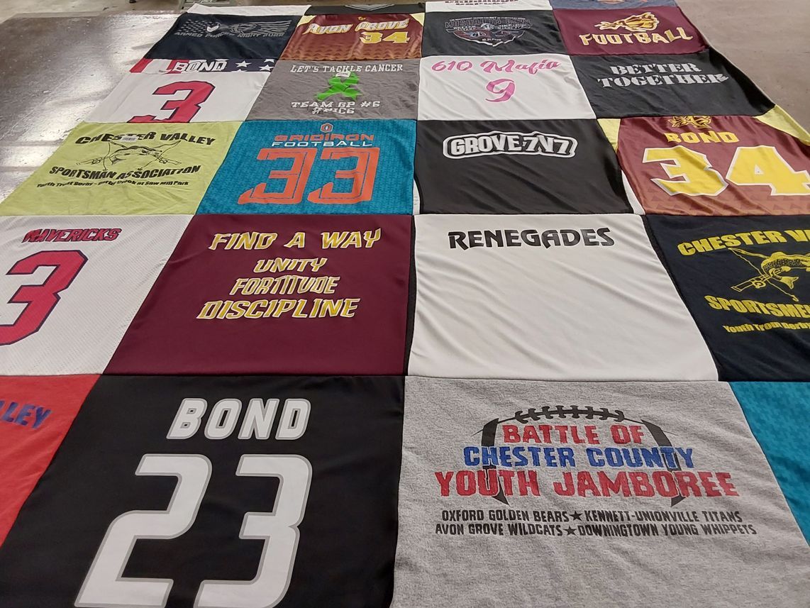 T-shirt quilt with sports, community themes by Jennifer from PA