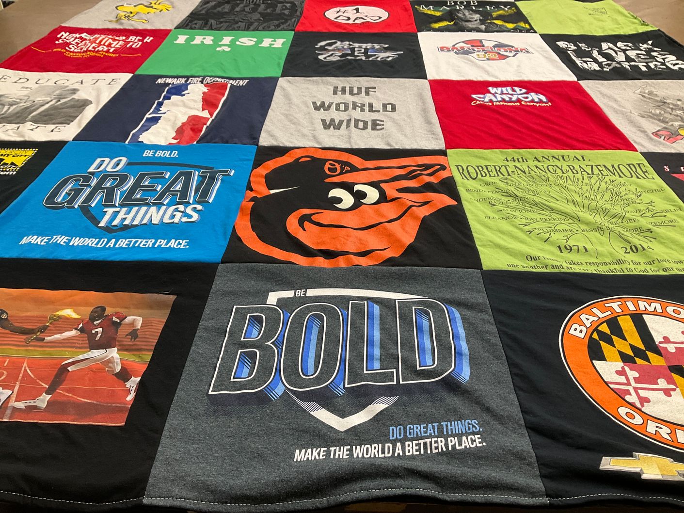 T-shirt quilt with community, education themes by Jenifer from NY