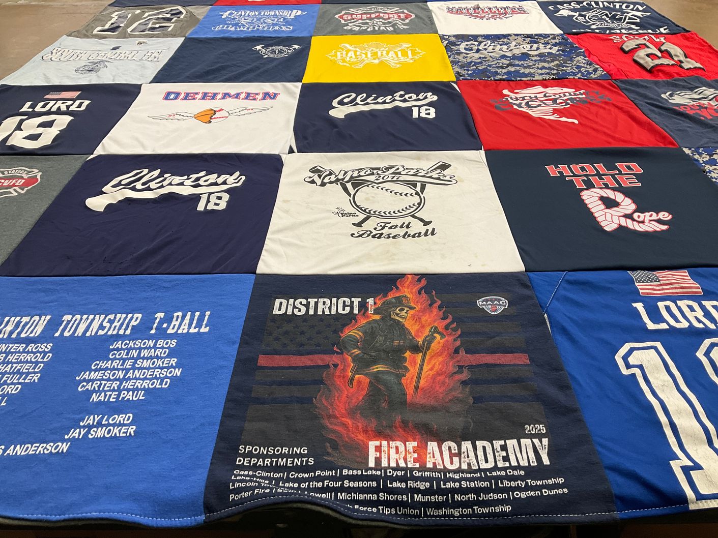 T-shirt quilt with baseball, firefighting themes by Candace from IN
