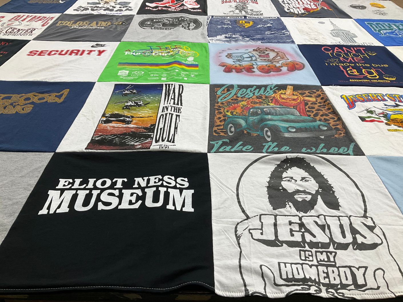 T-shirt quilt with religion, history themes by Ann-Catherine from MD