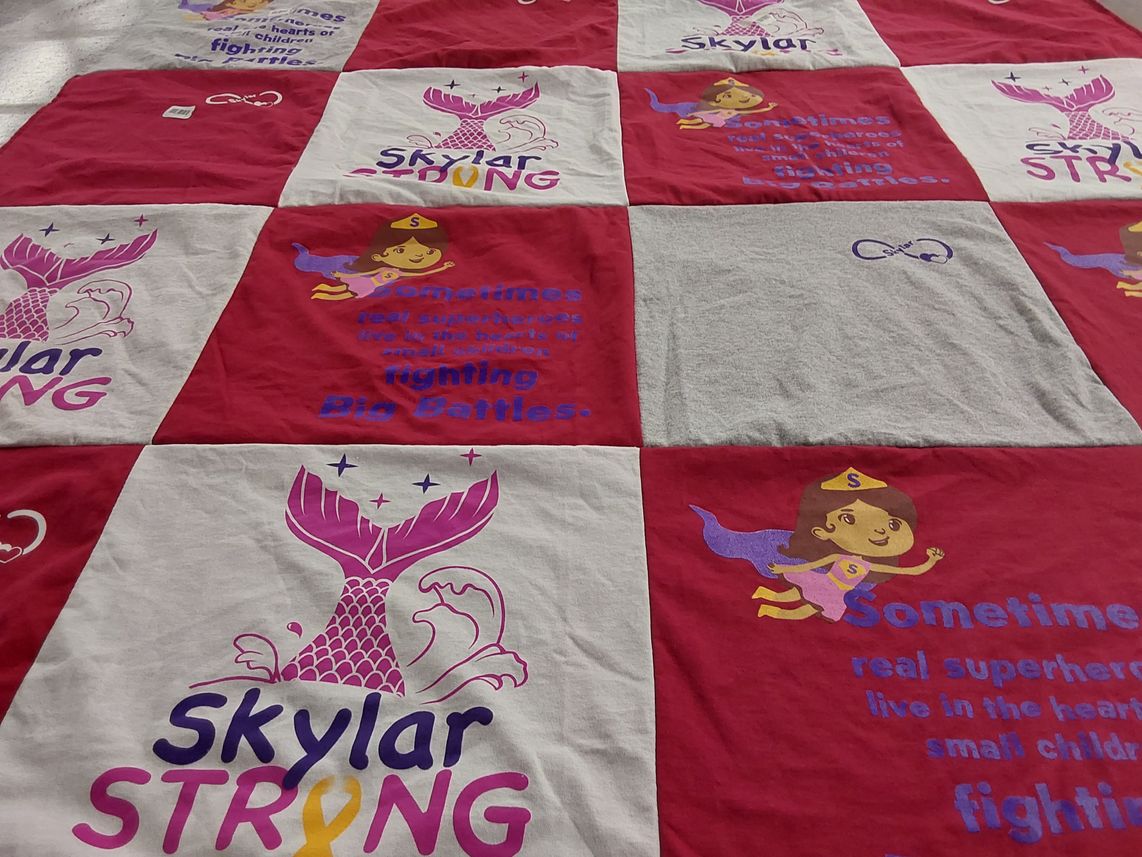 T-shirt quilt with childhood cancer awareness, superheroes themes by Denise from RI