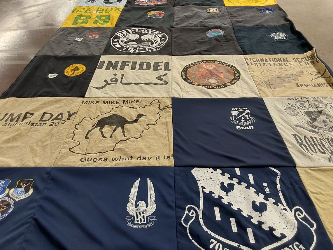 T-shirt quilt with military, outdoor themes by Erika from MD