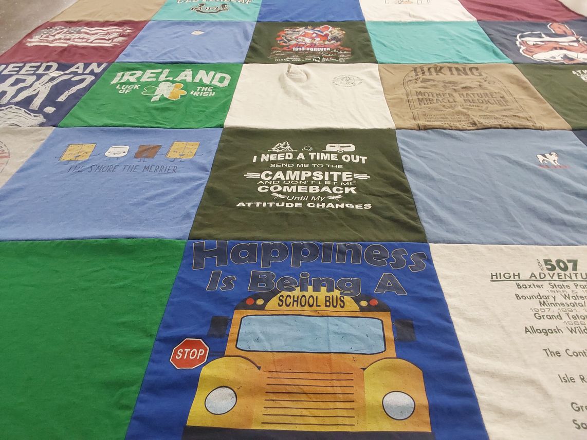 T-shirt quilt with camping, hiking themes by Sandra from OH